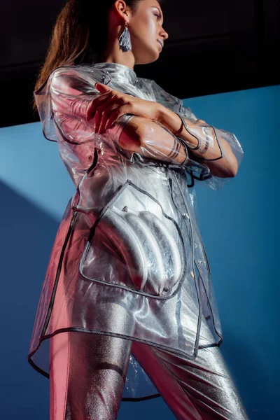 Bottom View Fashionable Model Metallic Bodysuit Raincoat Posing Silver Bananas — Free Stock Photo