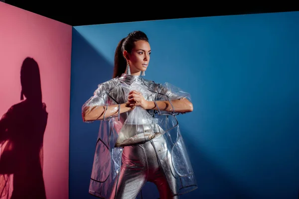 Trendy Young Woman Silver Bodysuit Raincoat Holding Plastic Bag Fish — Stock Photo, Image