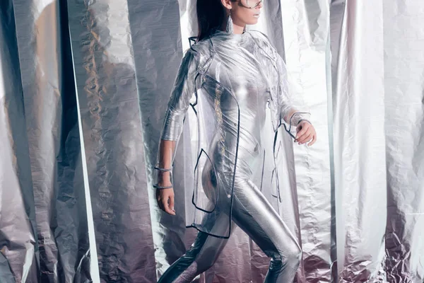 Cropped View Stylish Woman Posing Silver Bodysuit Raincoat Metallic Background — Free Stock Photo