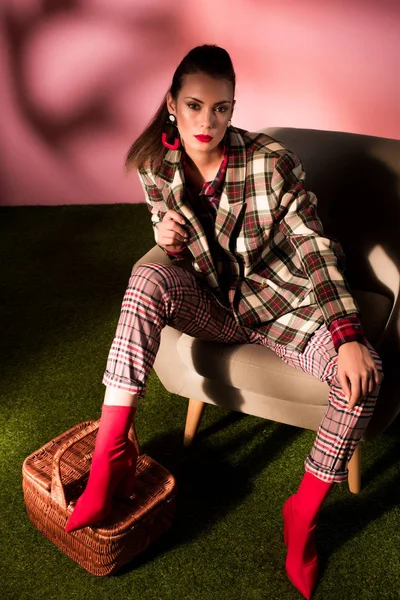 Fashionable Woman Checkered Suit Posing Armchair Basket — Free Stock Photo