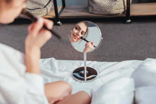 Partial View Pretty Girl Applying Makeup Brush Looking Mirror Bed — Stock Photo, Image