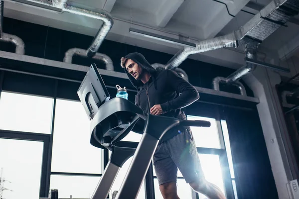 Low Angle View Handsome Sportive Man Hoodie Exercising Treadmill Gym — Stock Photo, Image