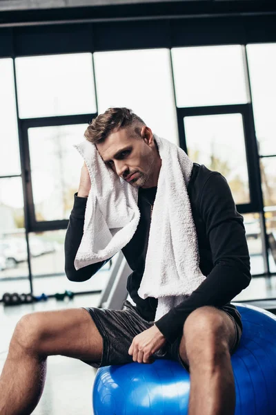 Handsome Tired Sportsman Sitting Fitness Ball Towel Gym — Free Stock Photo