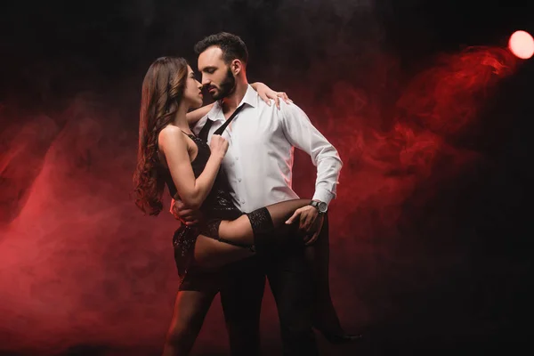 Heterosexual Passionate Couple Hugging Red Smoky Room — Stock Photo, Image