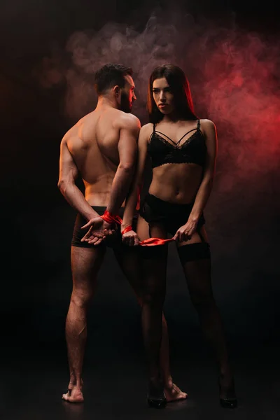 Seductive Couple Red Ribbon Smoky Room — Stock Photo, Image