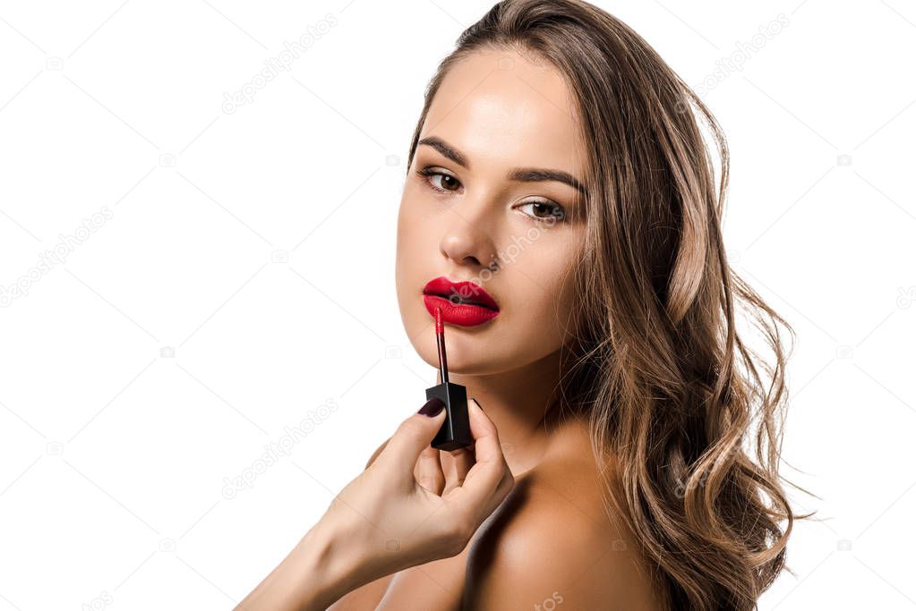 cropped view of woman making up lips of beautiful girl isolated on white