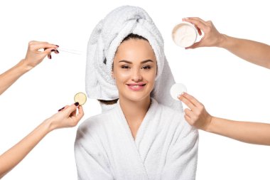 cropped view of women holding cosmetic accessories and beautiful girl in bathrobe isolated on white clipart