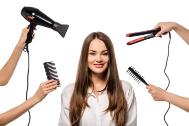 women holding accessories of hairdresser around beautiful girl looking at camera clipart