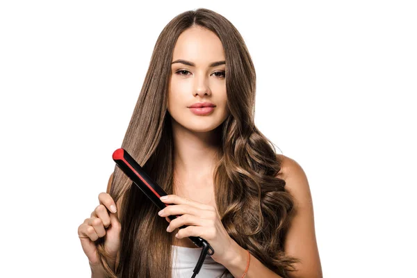Beautiful Girl Long Brown Hair Using Straightener Looking Camera Isolated — Stock Photo, Image