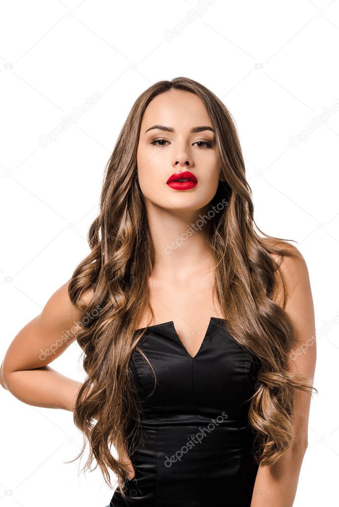 beautiful girl with red lips in black dress looking at camera isolated on white