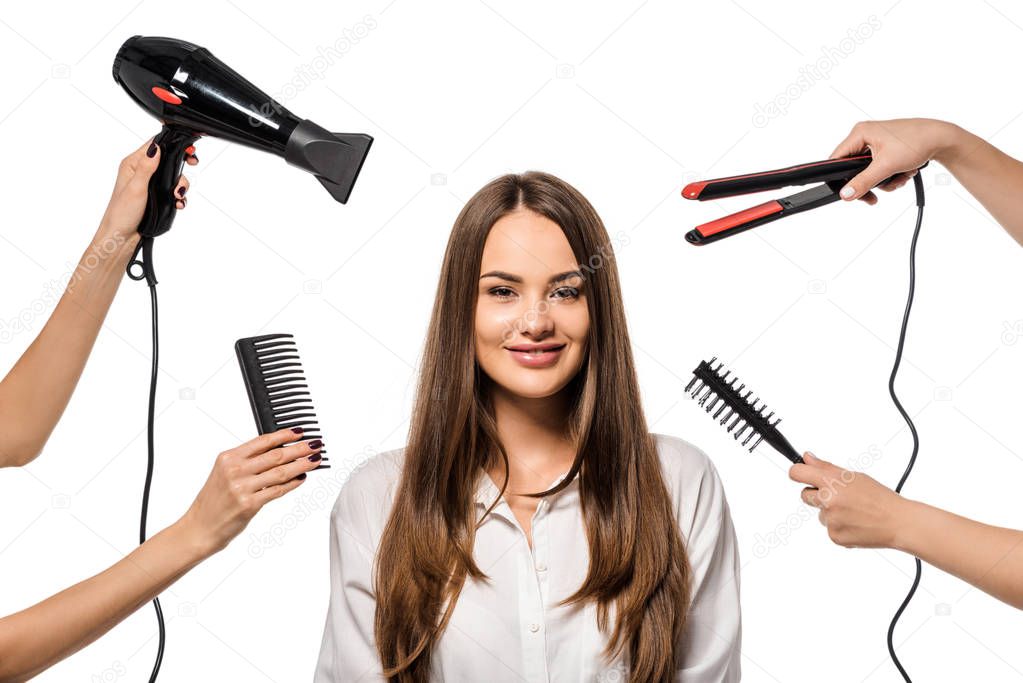 women holding accessories of hairdresser around beautiful girl looking at camera