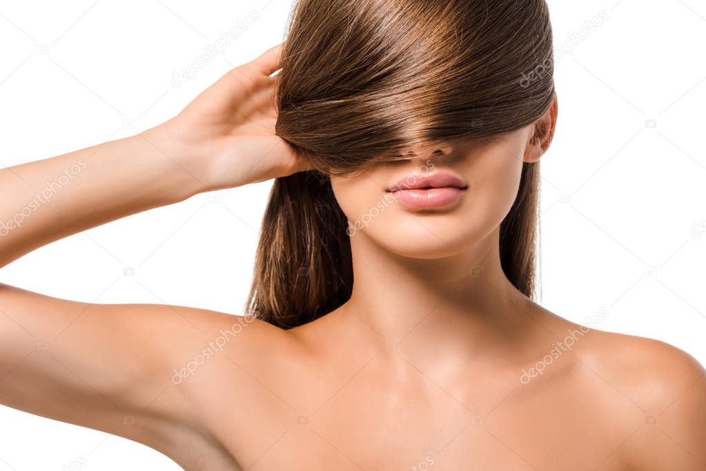 young girl covering eyes with long brown hair isolated on white