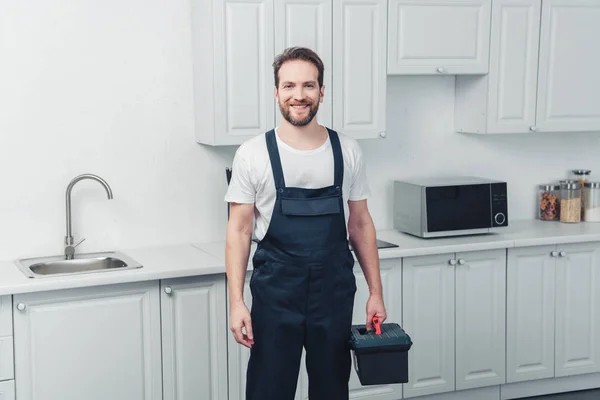 Happy Repairman Working Overall Holding Toolbox Kitchen Home — Stock Photo, Image