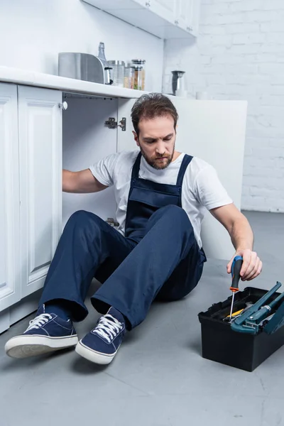 Handyman Working Overall Fixing Oven Taking Tools Toolbox Kitchen — Stock Photo, Image