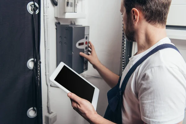 Male Bearded Repairman Digital Tablet Checking Electric Box — Stock Photo, Image