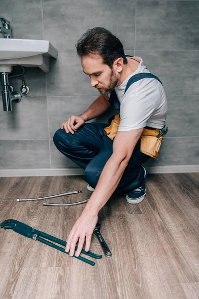 Adult Male Plumber Taking Gas Wrench Repairing Broken Sink Bathroom — Stock Photo, Image