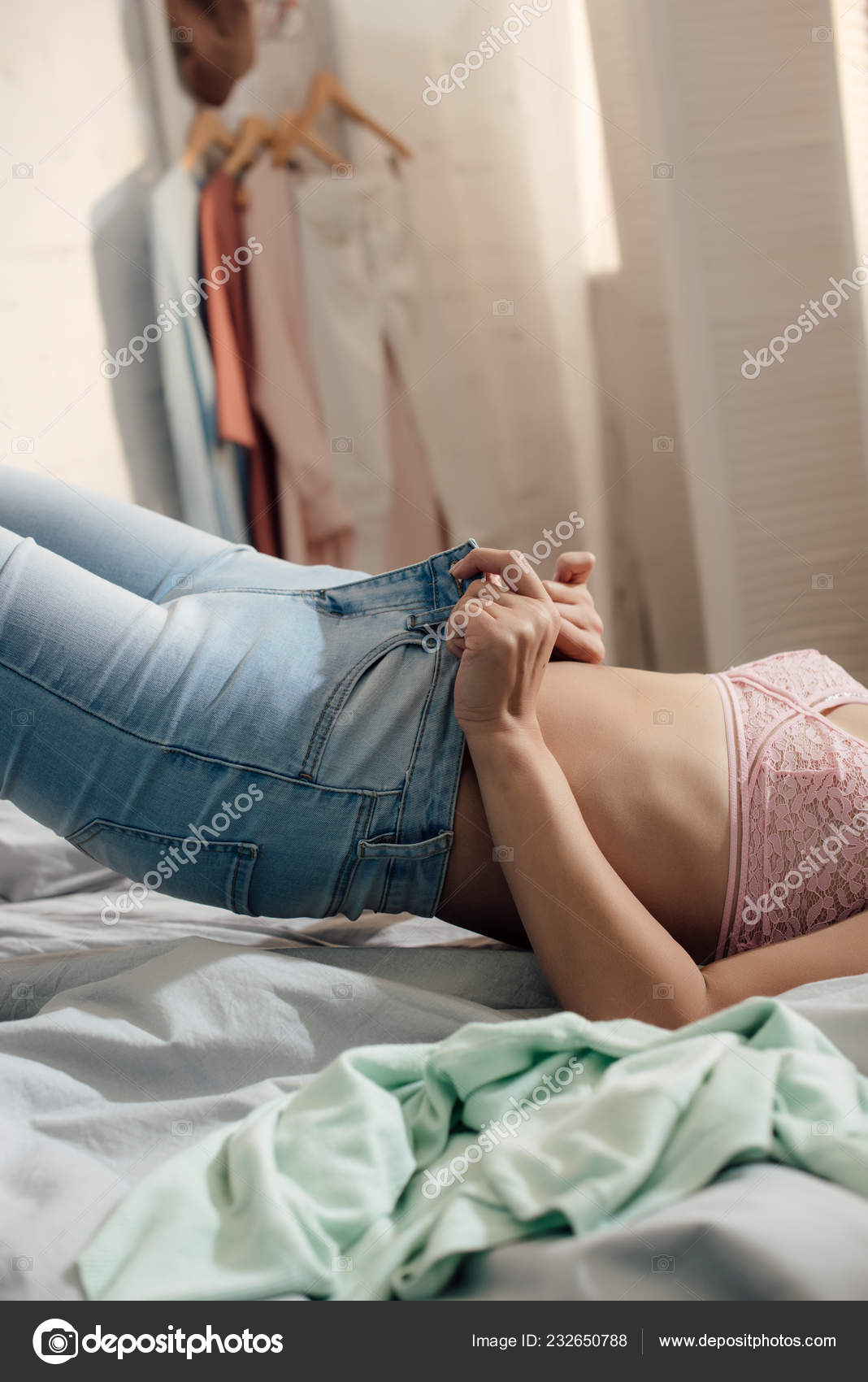 Mid Section Girl Pink Bra Lying Bed Putting Denim Pants Stock Photo by  ©VitalikRadko 232650788