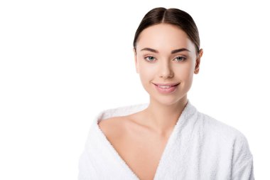 attractive smiling woman in bathrobe looking at camera isolated on white clipart