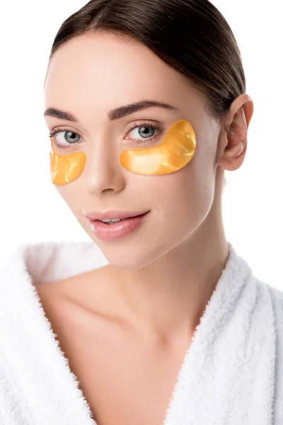 Beautiful Woman White Bathrobe Golden Eye Patches Looking Camera Isolated — Stock Photo, Image