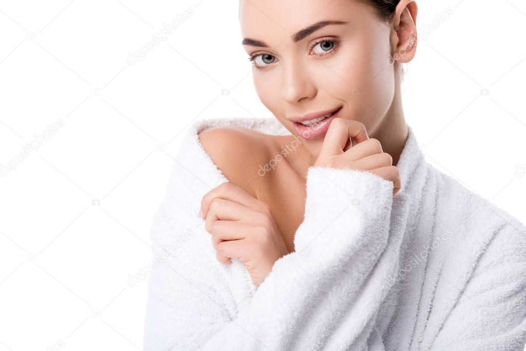 beautiful woman in bathrobe looking at camera isolated on white