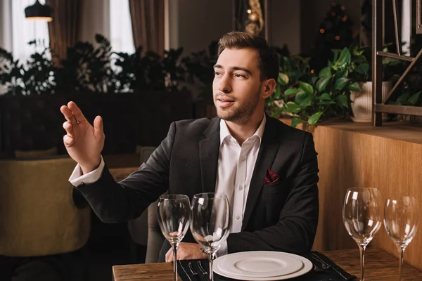 Handsome Man Suit Waiting Girlfriend Restaurant Rising Hand — Stock Photo, Image