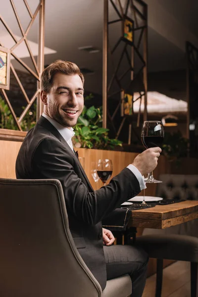Handsome Man Holding Glass Red Wine While Sitting Restaurant — Stock Photo, Image