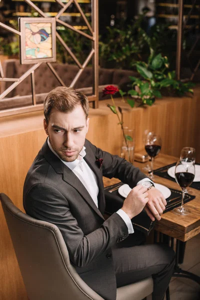 Handsome Man Touching Watch While Waiting Restaurant — Stock Photo, Image