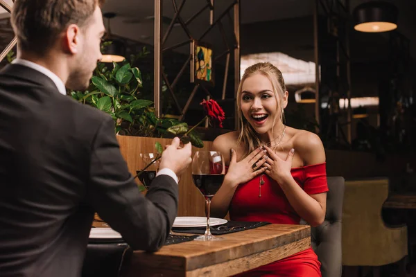 Boyfriend Giving Red Rose Excited Girl While Sitting Restaurant — Stock Photo, Image