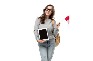 smiling female student holding canadian flag and presenting digital tablet with blank screen isolated on white clipart