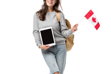 cropped view of female student holding canadian flag and presenting digital tablet with blank screen isolated on white clipart