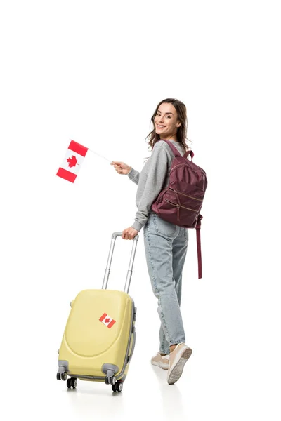 海外の概念を勉強するスーツケースとカナダ国旗の白地では 分離されたカメラを見て女子学生 — ストック写真