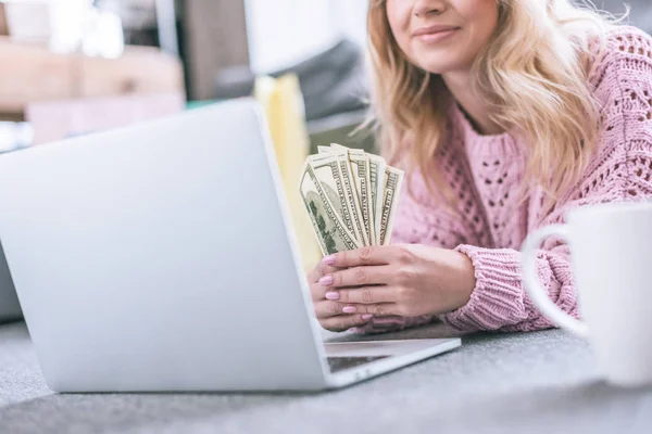 Cropped View Cheerful Woman Holding Dollar Banknotes While Lying Laptop — Stock Photo, Image