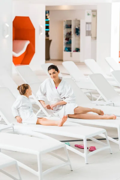 Daughter Looking Attractive Mother Bathrobe Lying Deck Chair — Stock Photo, Image