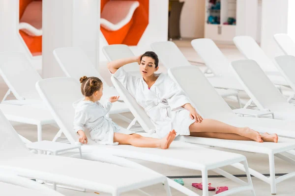 Attractive Mother Talking Daughter Bathrobe Lying Deck Chair — Stock Photo, Image