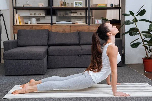 Young Woman Practicing Cobra Pose Living Room Home — Stock Photo, Image