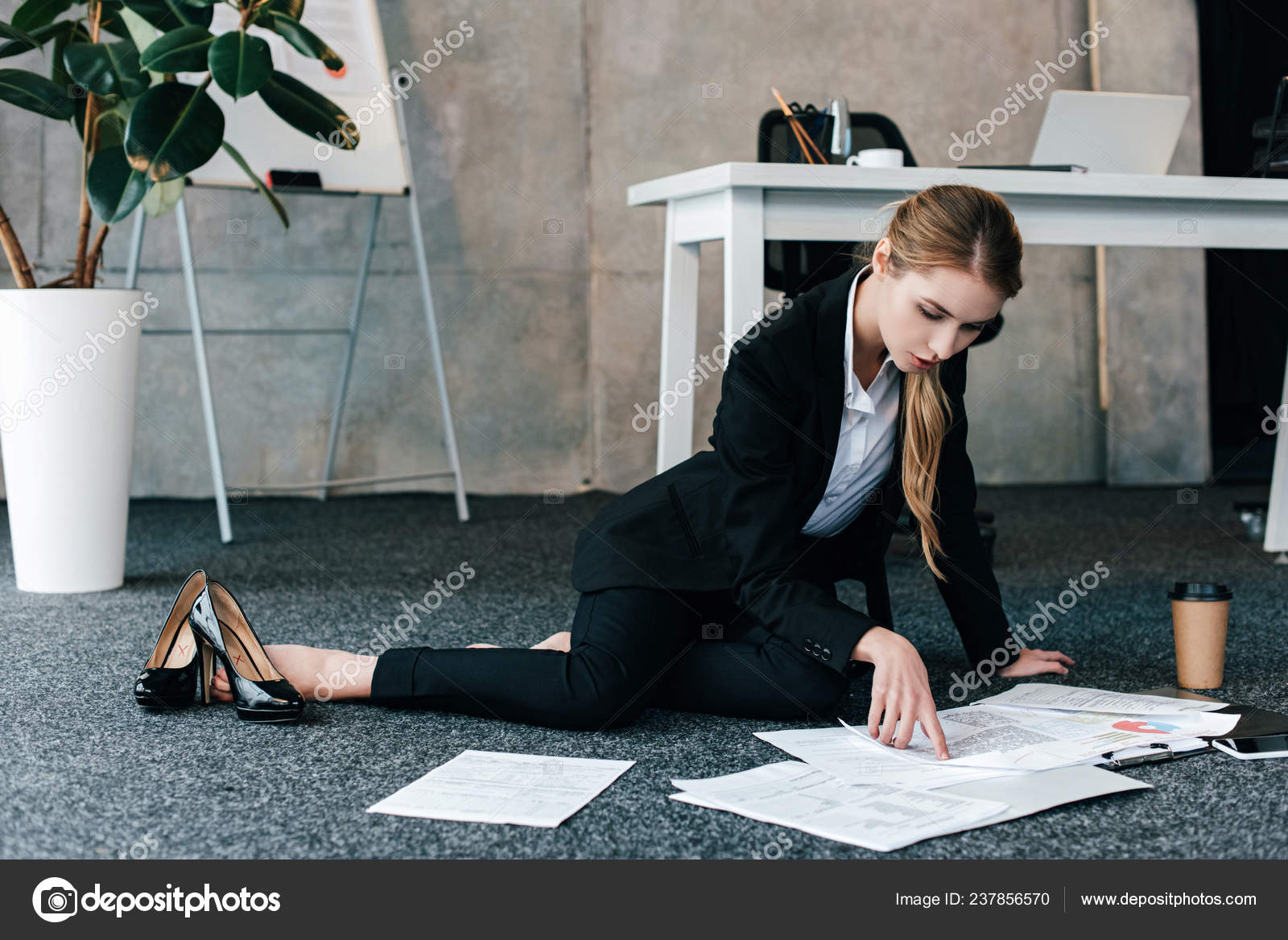 Barefoot Businesswoman Sitting Floor Work Table Reading Documents