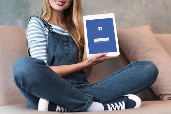 Cropped View Young Girl Sitting Sofa Showing Screen Facebook — Stock Photo, Image