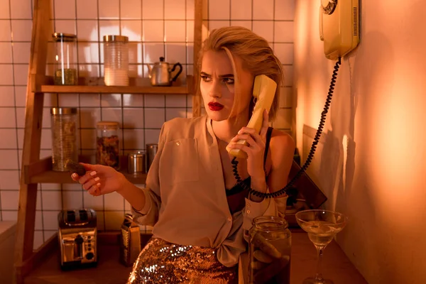 Beautiful Confused Woman Talking Retro Telephone Kitchen Orange Light — Stock Photo, Image