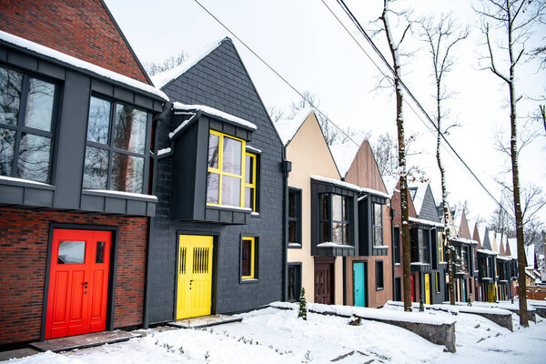 fancy modern buildings in cold winter with snow on ground 