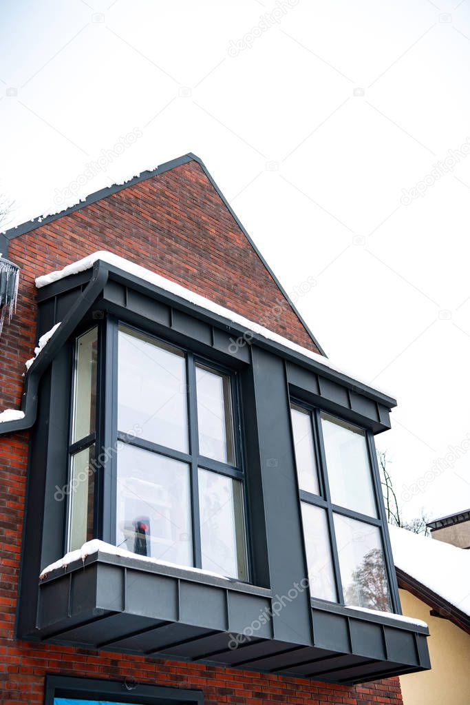 close up of luxurious house with windows in winter