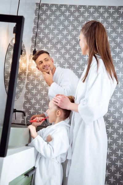 Cheerful Man Looking Wife Standing Daughter Brushing Teeth Bathroom — Stock Photo, Image