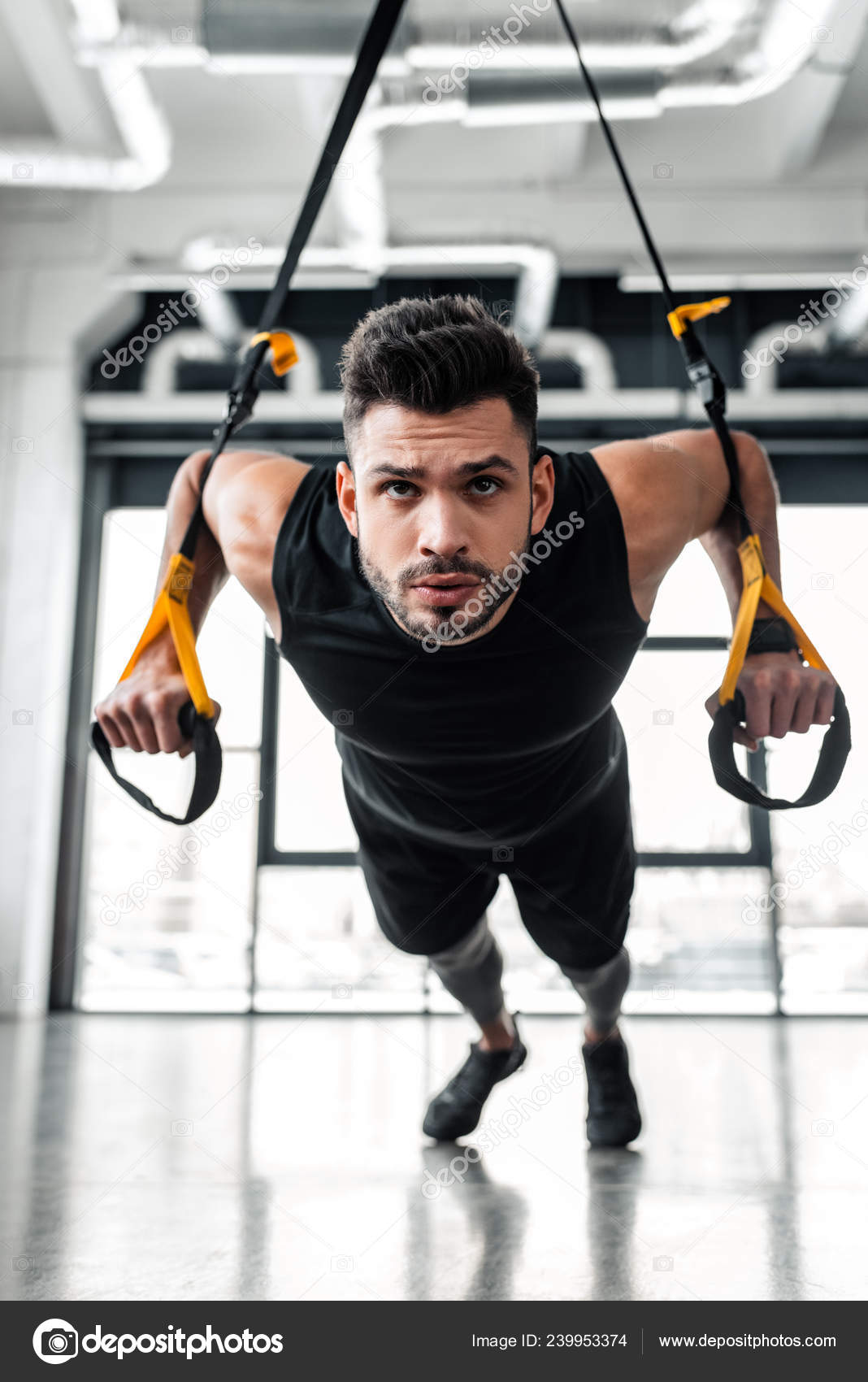 Handsome Serious Young Sportsman Hanging Training Resistance Bands Gym Stock Photo VitalikRadko 239953374
