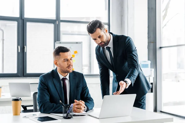 Handsome Businessman Showing Something Laptop Coworker — Stock Photo, Image
