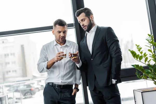 Businessmen Standing Hands Pockets While Holding Glasses Alcohol Drinks — Stock Photo, Image
