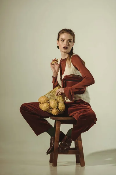 Fashionable Girl Sitting Stool Lemons String Bag Beige — Stock Photo, Image