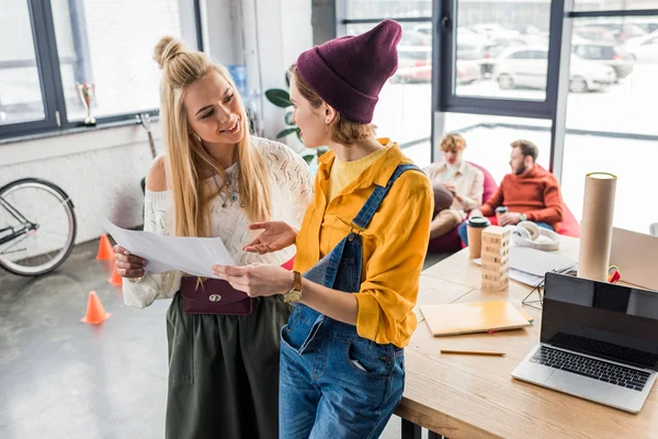 Beautiful Female Architects Looking Each Other While Working Blueprint Loft — Stock Photo, Image