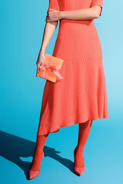 Cropped View Stylish Girl Living Coral Dress Holding Gift Box — Stock Photo, Image