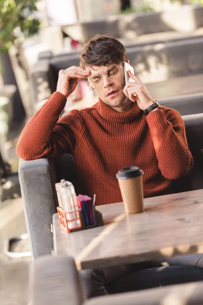 Selective Focus Tired Man Glasses Talking Smartphone Holding Head Paper — Stock Photo, Image