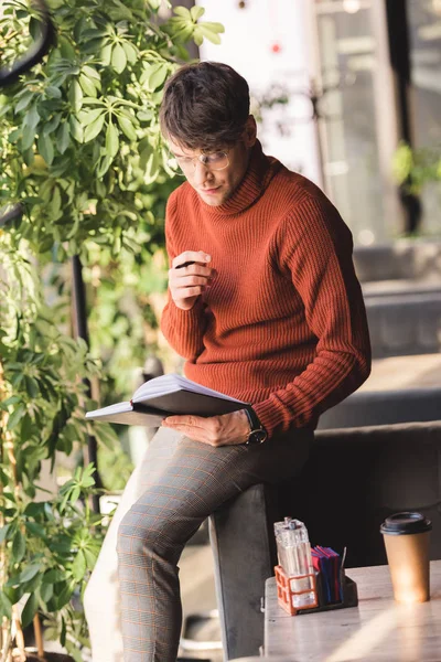 Handsome Man Glasses Looking Notebook While Standing Cafe — Stock Photo, Image