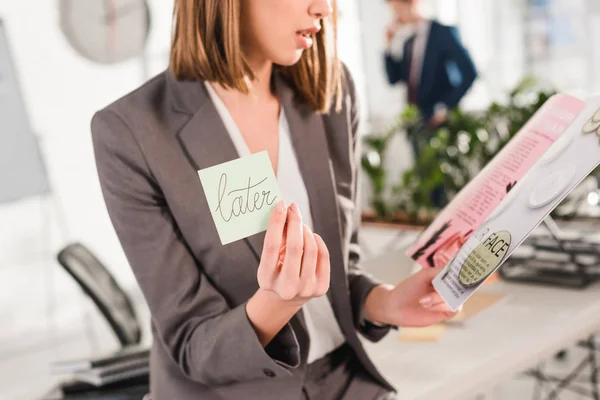 Cropped View Businesswoman Holding Sticky Note Later Lettering Magazine Hands — Stock Photo, Image